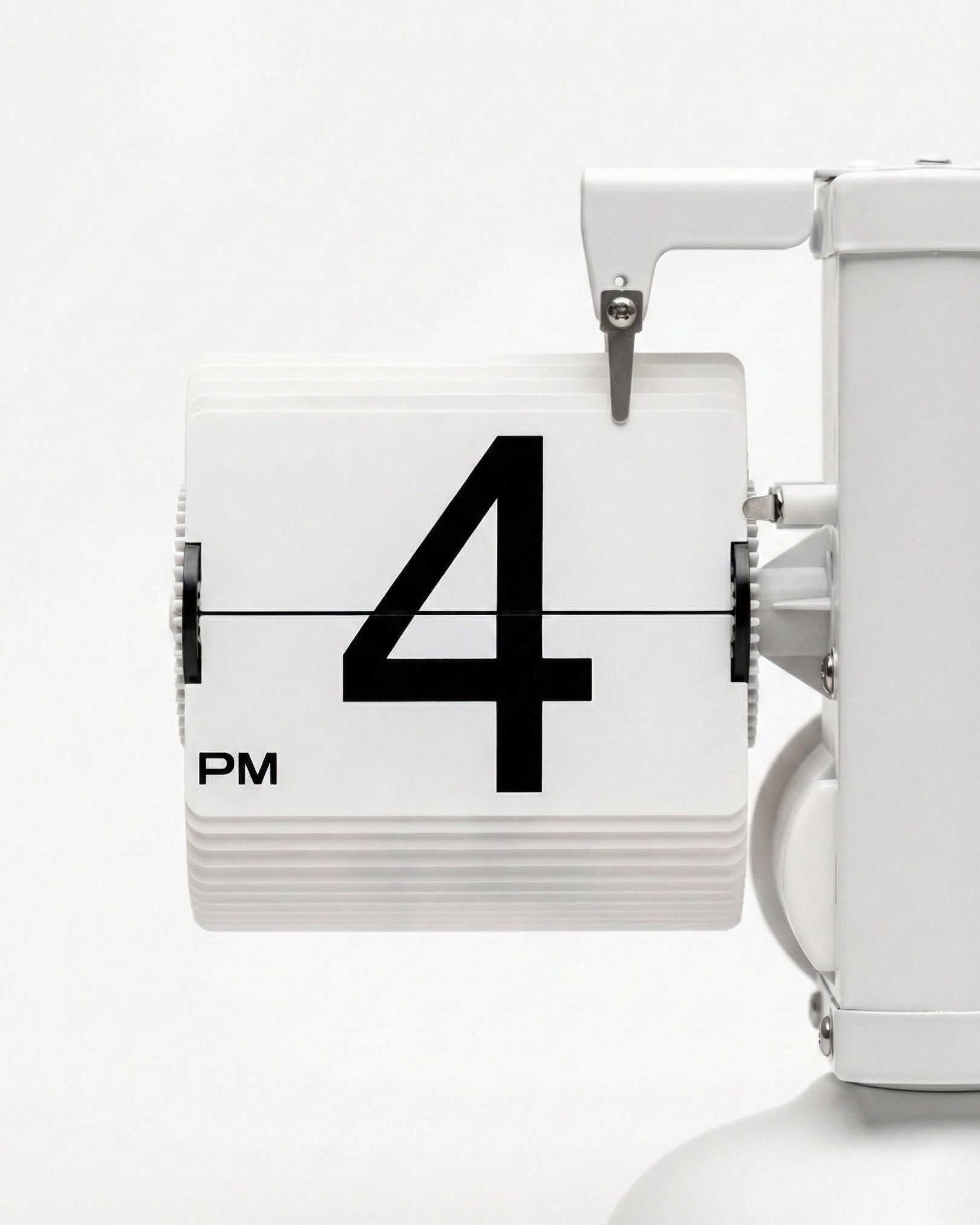 Close-up of the large white PVC number cards on a quartz movement mechanical desktop clock.