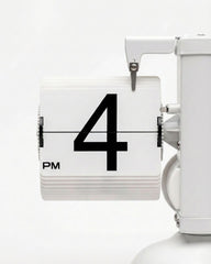 Close-up of the large white PVC number cards on a quartz movement mechanical desktop clock.