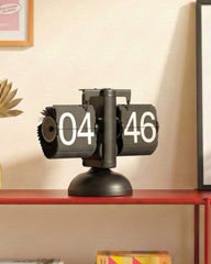 Side view of gear-operated vintage desk clock showing the mechanical flip-down minute and hour cards.