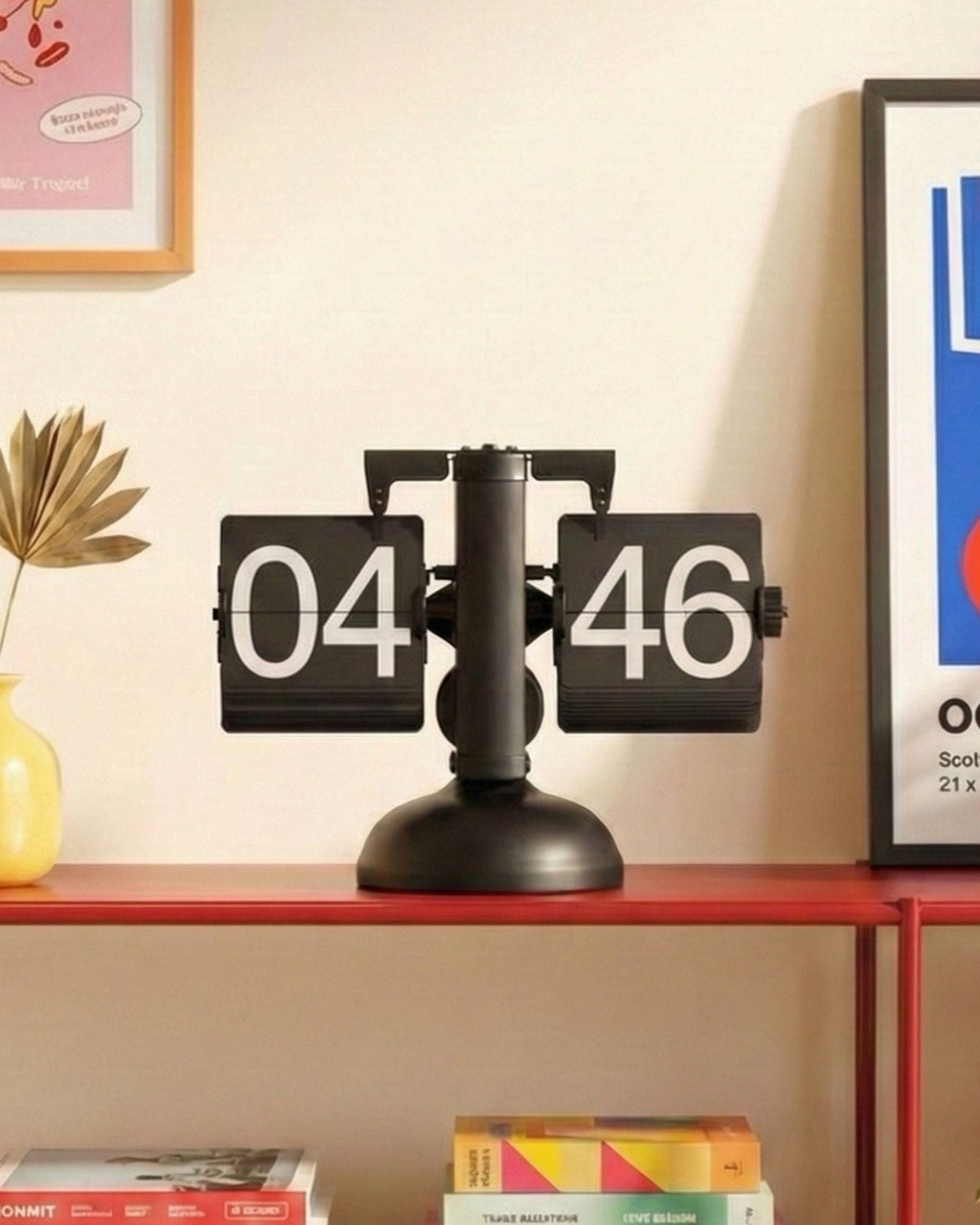 Retro mechanical flip clock with black and white 24-hour display and stainless steel frame.