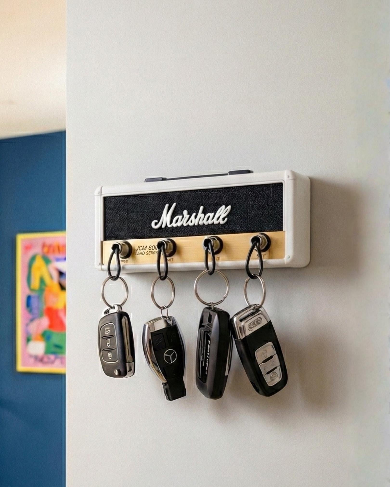 White Marshall Jack Rack key holder with iconic gold faceplate and four input jacks.
