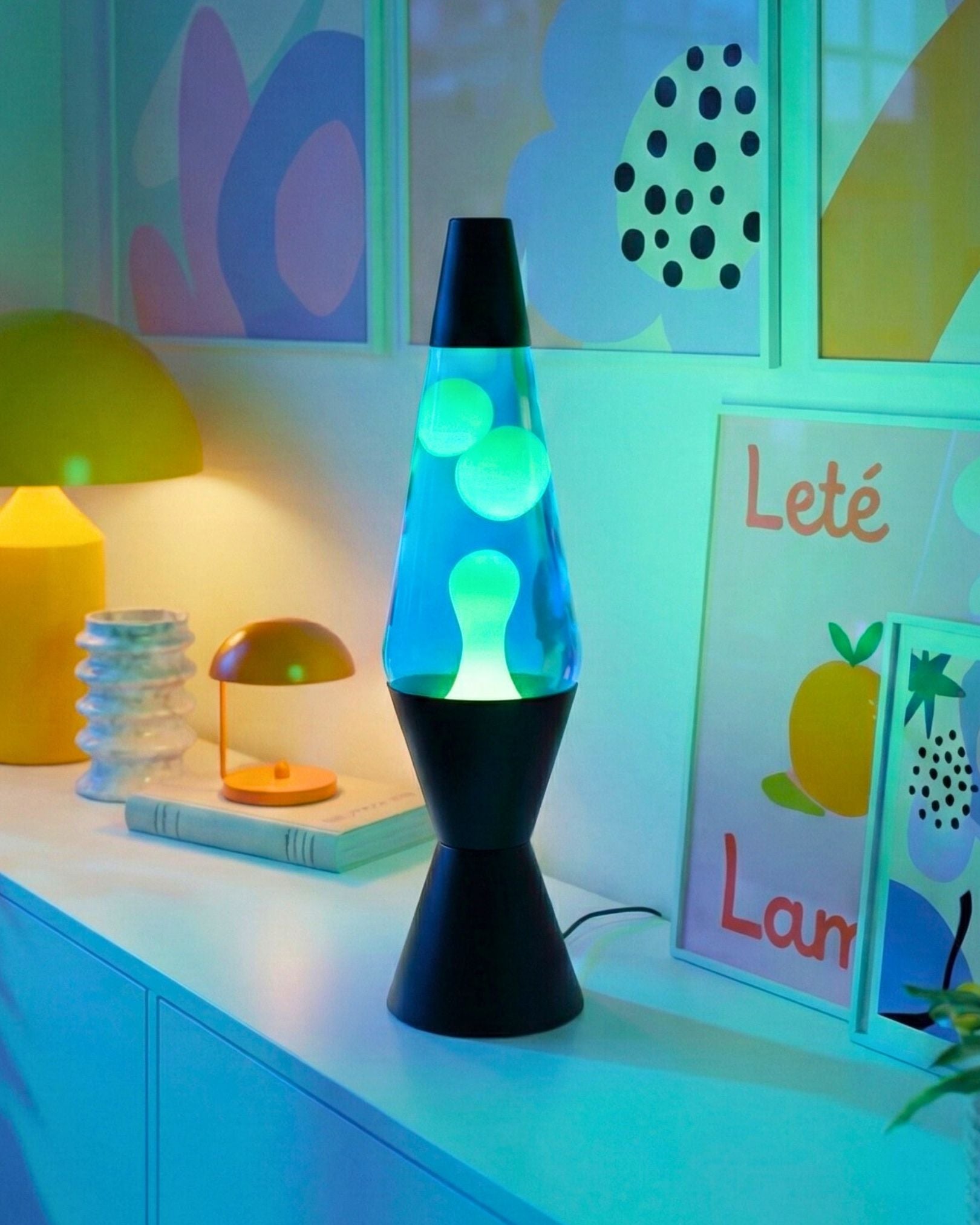 Modern cylinder lava lamp placed on a table, highlighting its compact 10cm diameter design.