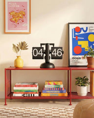 Black and white automated flip clock powered by a single D battery, perfect for home office or shelf decor.