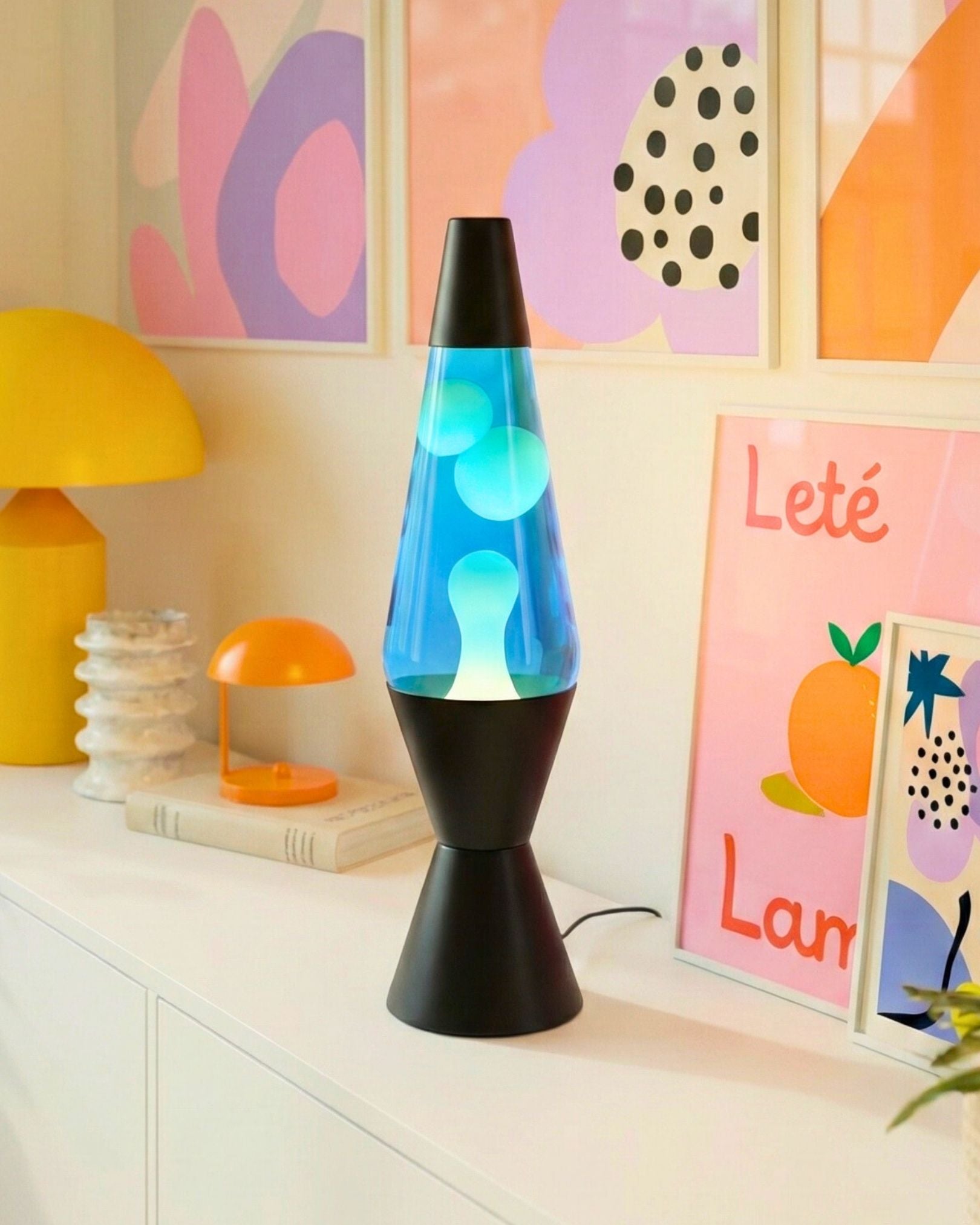 Classic retro lava lamp with a sleek black aluminum base and cap, standing 36cm tall.